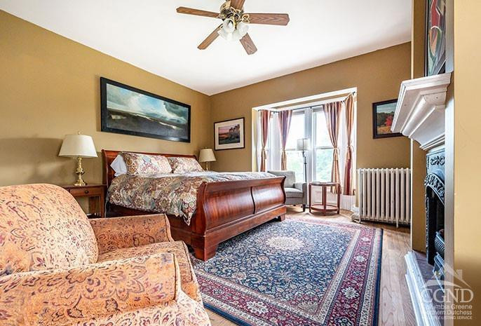 5 Willard Place Hudson, NY 12534 - Photo 9 of 26 a bedroom with a bed lamp and a rug