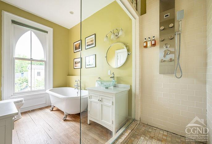 5 Willard Place Hudson, NY 12534 - Photo 10 of 26 a spacious bathroom with a sink mirror toilet and shower