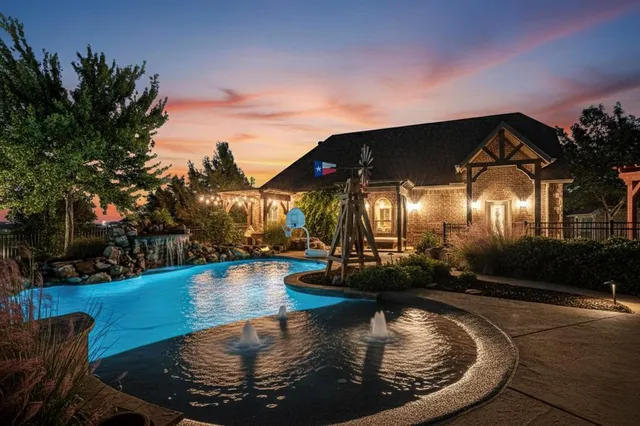 a view of a house with swimming pool