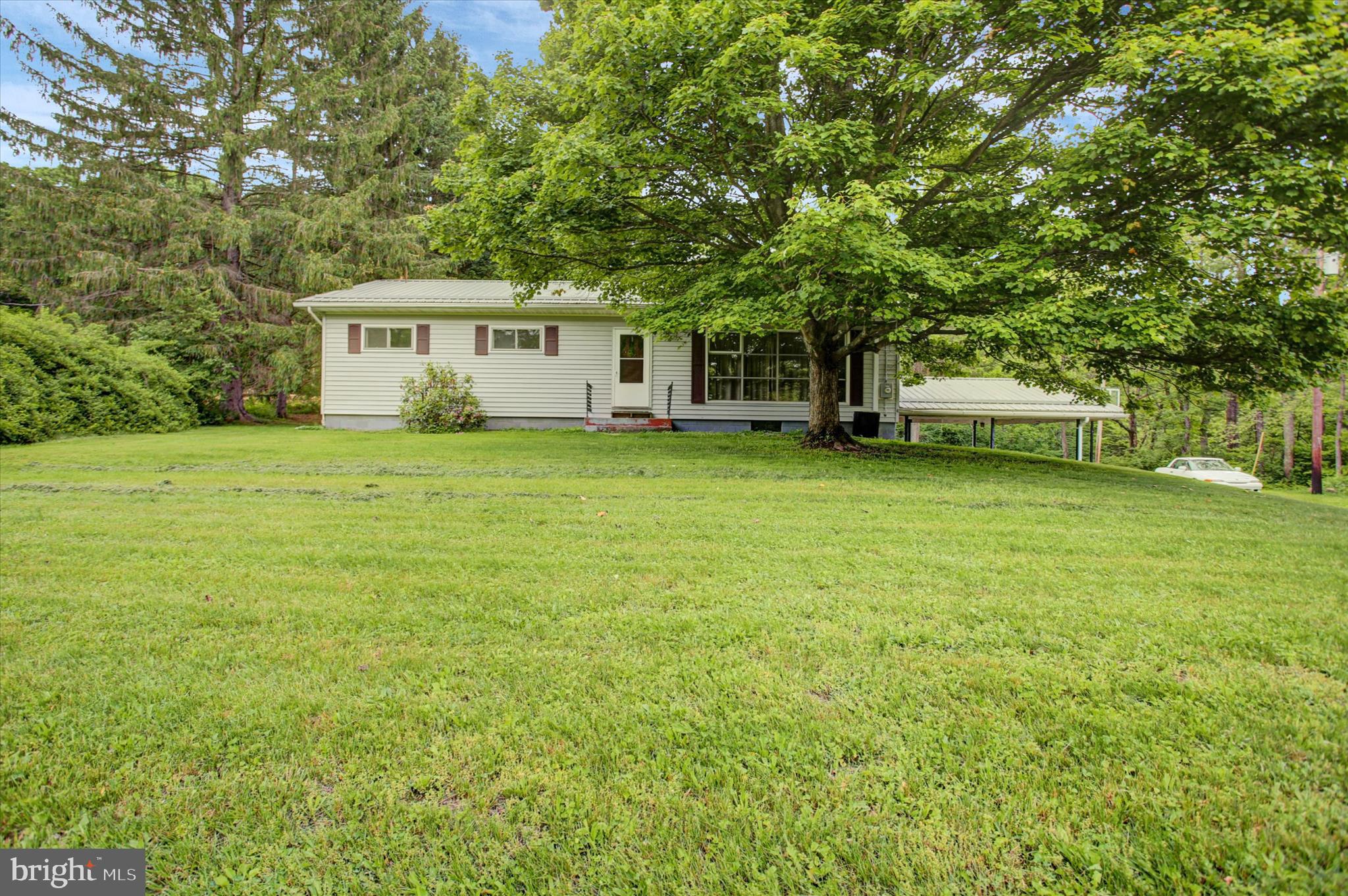 5156 Peach Orchard Road McConnellsburg, PA 17233 - Photo 2 of 34 a view of a house with a backyard