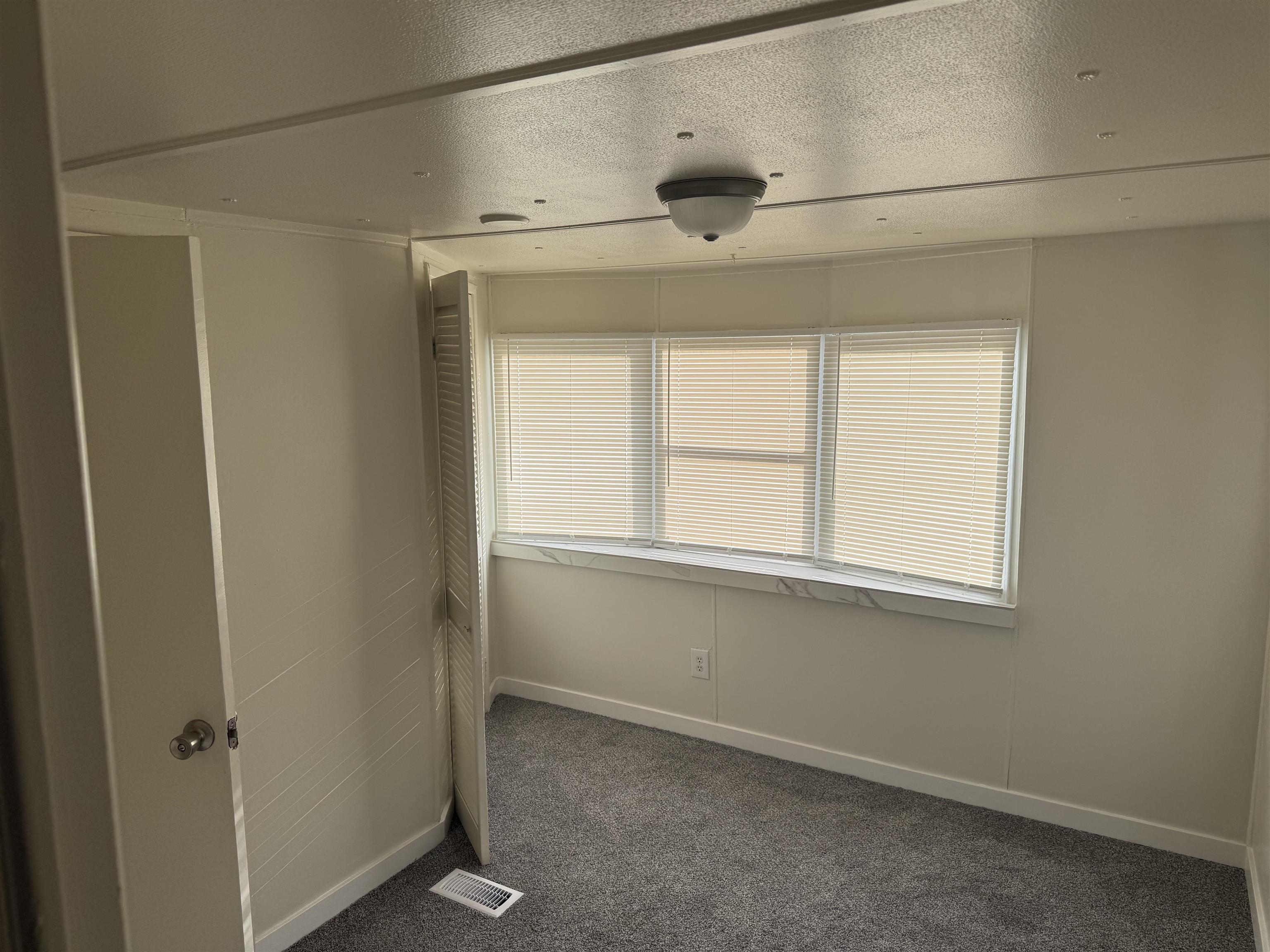 585-25 25 1/2 Road, Unit 41 Grand Junction, CO 81505 - Photo 20 of 22 a view of an empty room with a window