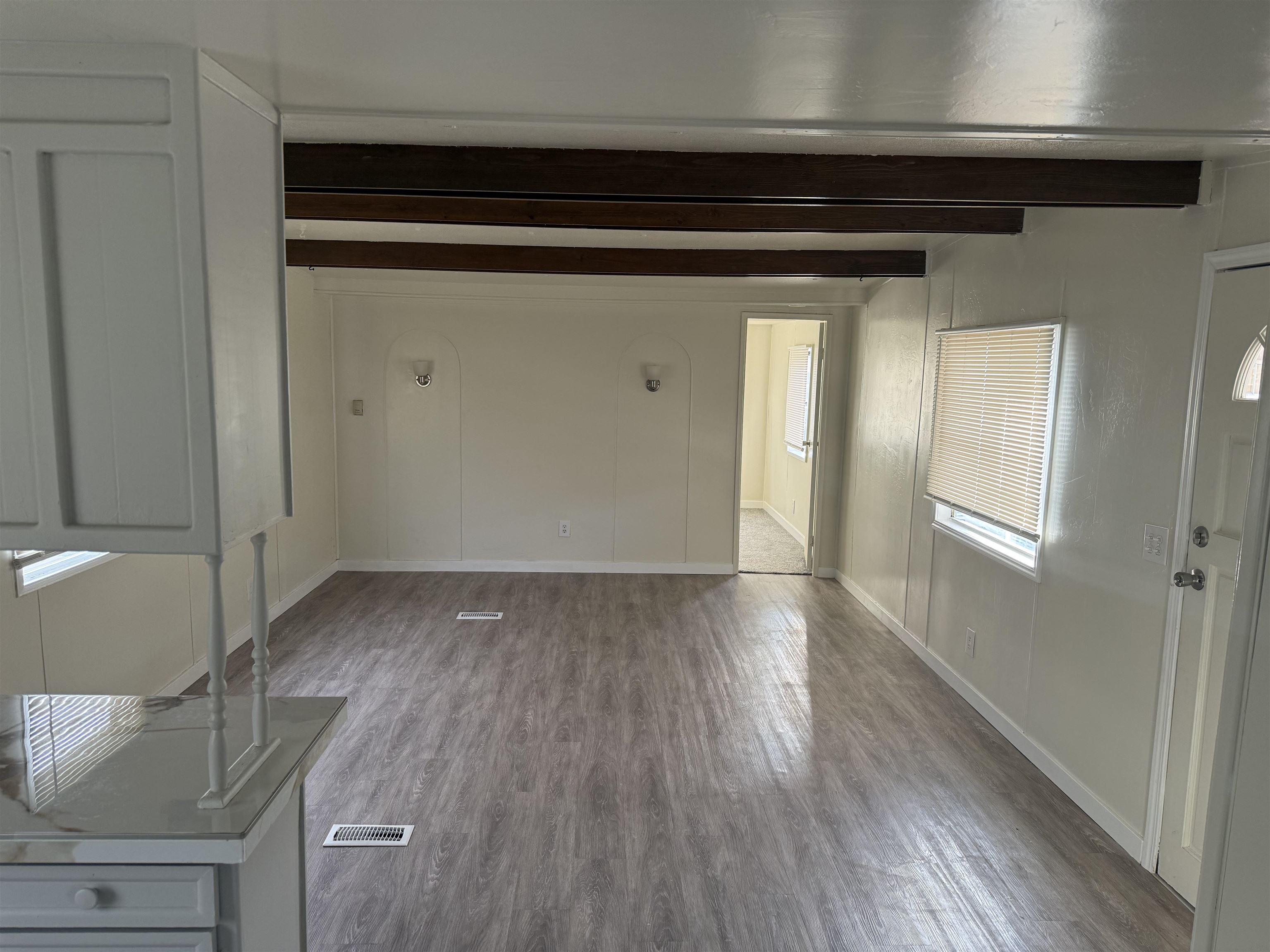585-25 25 1/2 Road, Unit 41 Grand Junction, CO 81505 - Photo 21 of 22 a view of an empty room with wooden floor and closet