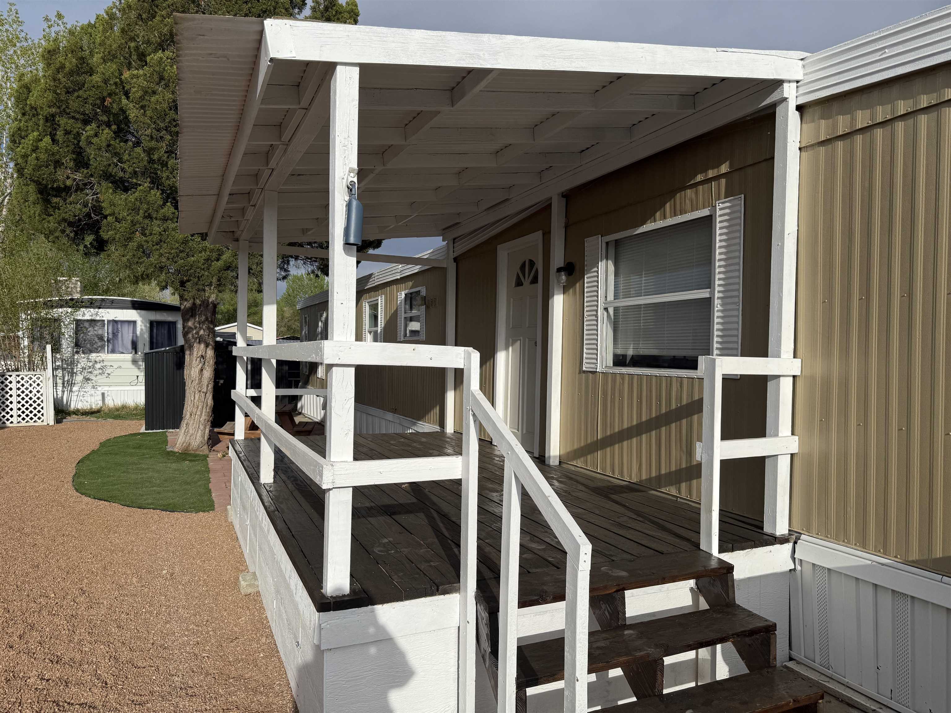 585-25 25 1/2 Road, Unit 41 Grand Junction, CO 81505 - Photo 3 of 22 a view of a house with backyard and sitting area