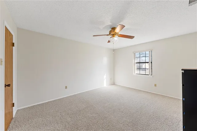 a view of yard with wooden fence