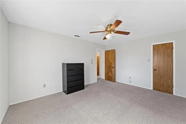 a view of a yard with a house and a large tree