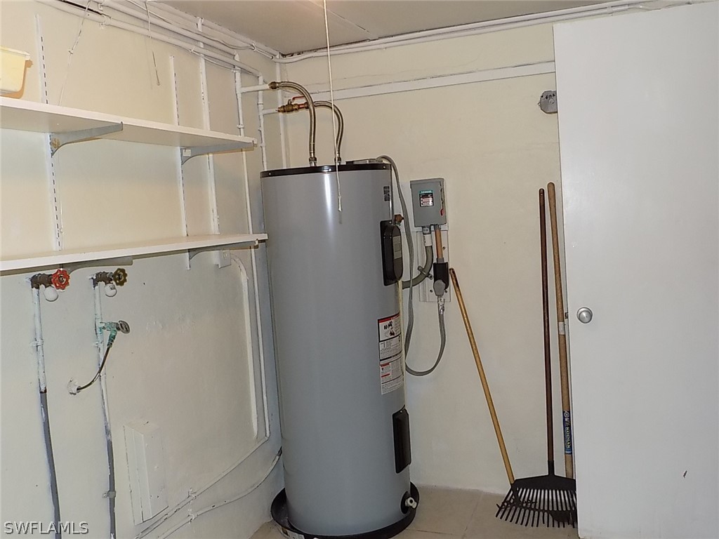 2105 Pineview Road Fort Myers, FL 33901 - Photo 13 of 22 a view of water heater room with wooden floor