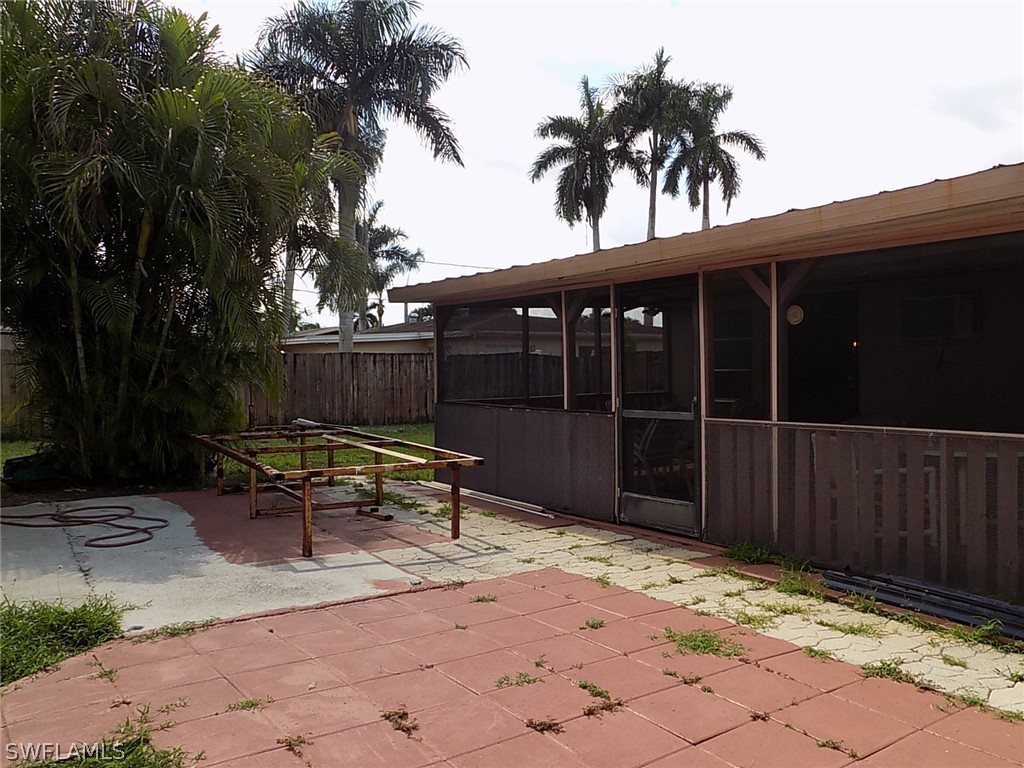 2105 Pineview Road Fort Myers, FL 33901 - Photo 18 of 22 a backyard of a house with table and chairs