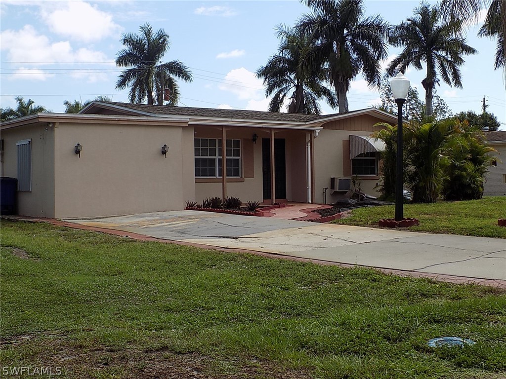 2105 Pineview Road Fort Myers, FL 33901 - Photo 2 of 22 front view of a house with a yard