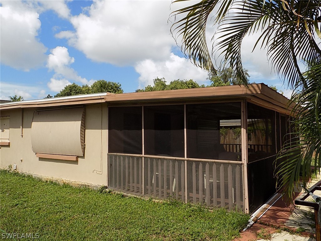 2105 Pineview Road Fort Myers, FL 33901 - Photo 22 of 22 a view of a house with a yard and wooden fence