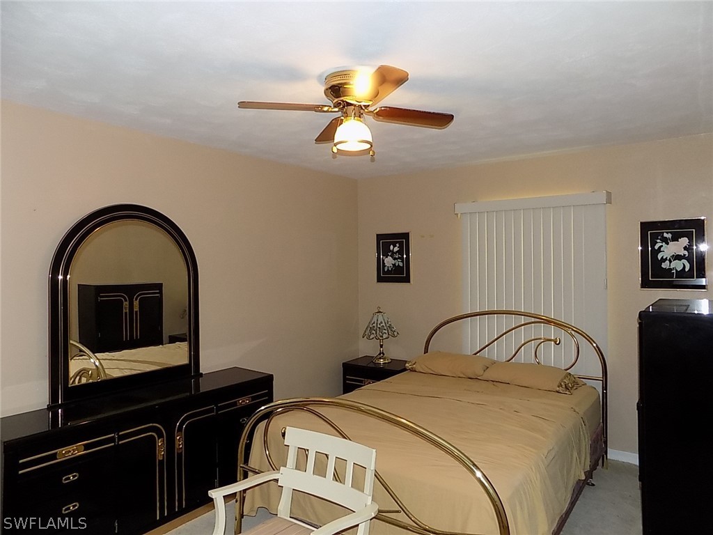2105 Pineview Road Fort Myers, FL 33901 - Photo 8 of 22 a bedroom with a bed and a potted plant