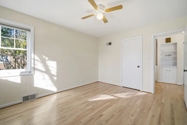 a view of a yard with wooden fence