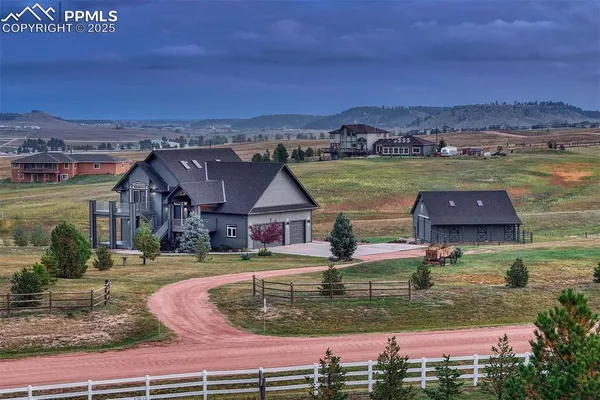 an aerial view of a house with a ocean view