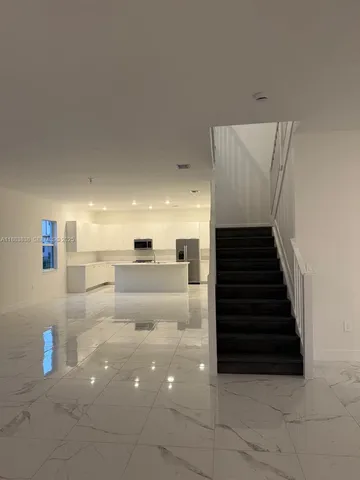 a bathroom with a sink a toilet a mirror and vanity