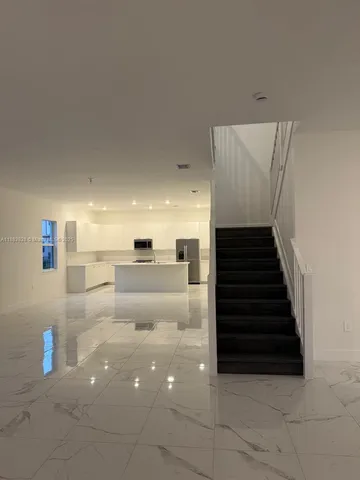 a bathroom with a sink a toilet a mirror and vanity