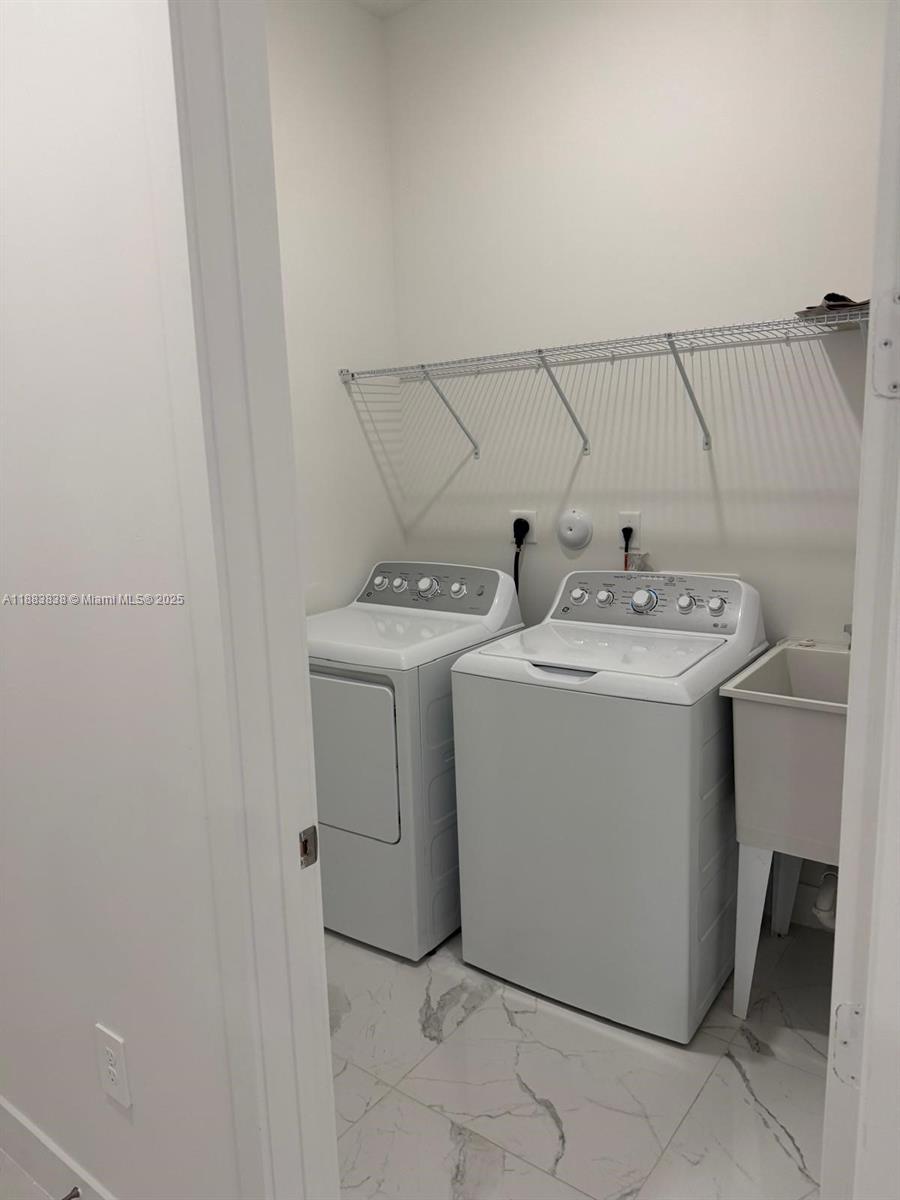 12303 Southwest 44th Street Davie, FL 33330 - Photo 18 of 42 a utility room with dryer and washer