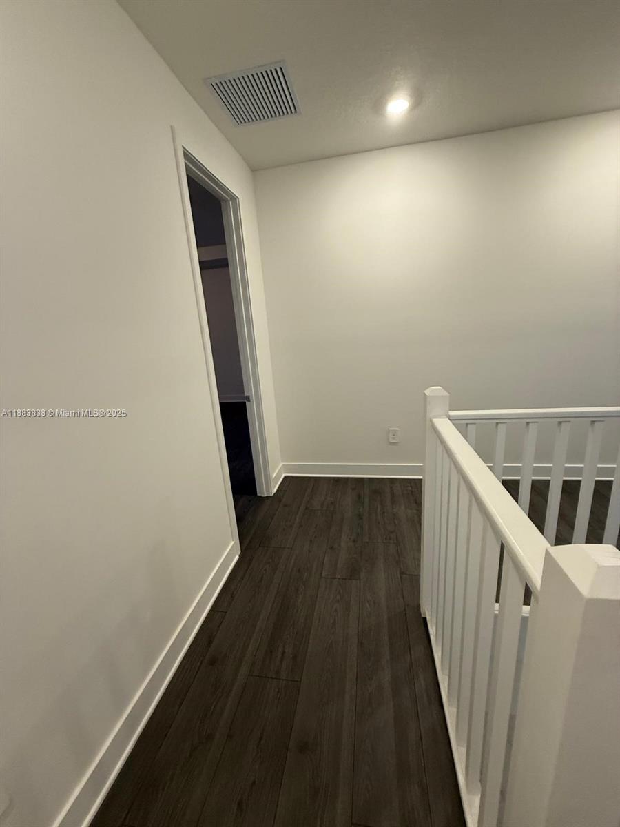 12303 Southwest 44th Street Davie, FL 33330 - Photo 26 of 42 a view of a hallway with wooden floor