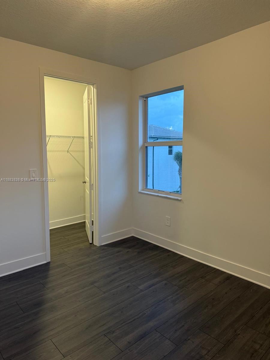 12303 Southwest 44th Street Davie, FL 33330 - Photo 32 of 42 an empty room with wooden floor and windows