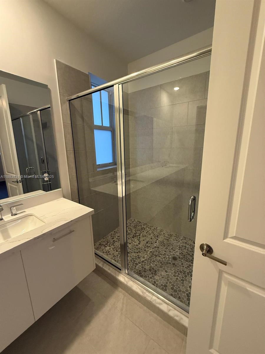 12303 Southwest 44th Street Davie, FL 33330 - Photo 33 of 42 a bathroom with a shower and a sink