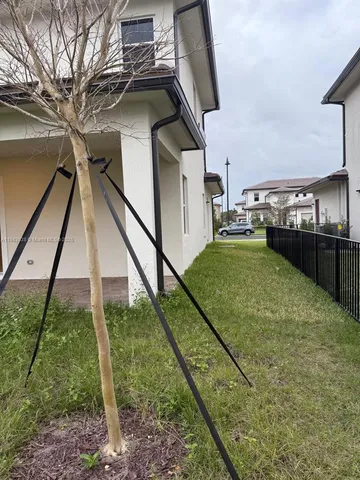 a backyard of a house with lots of green space
