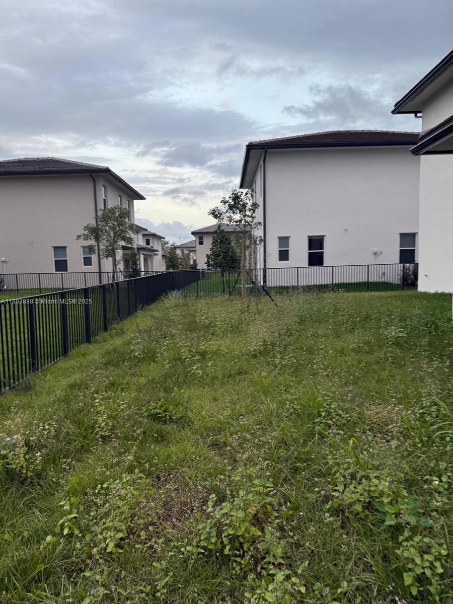 12303 Southwest 44th Street Davie, FL 33330 - Photo 42 of 42 a backyard of a house with lots of green space