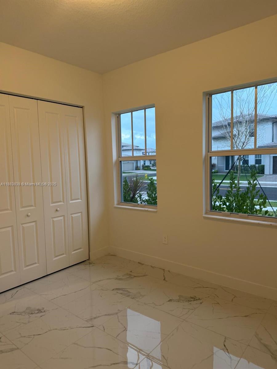 12303 Southwest 44th Street Davie, FL 33330 - Photo 6 of 42 a view of an empty room with a window