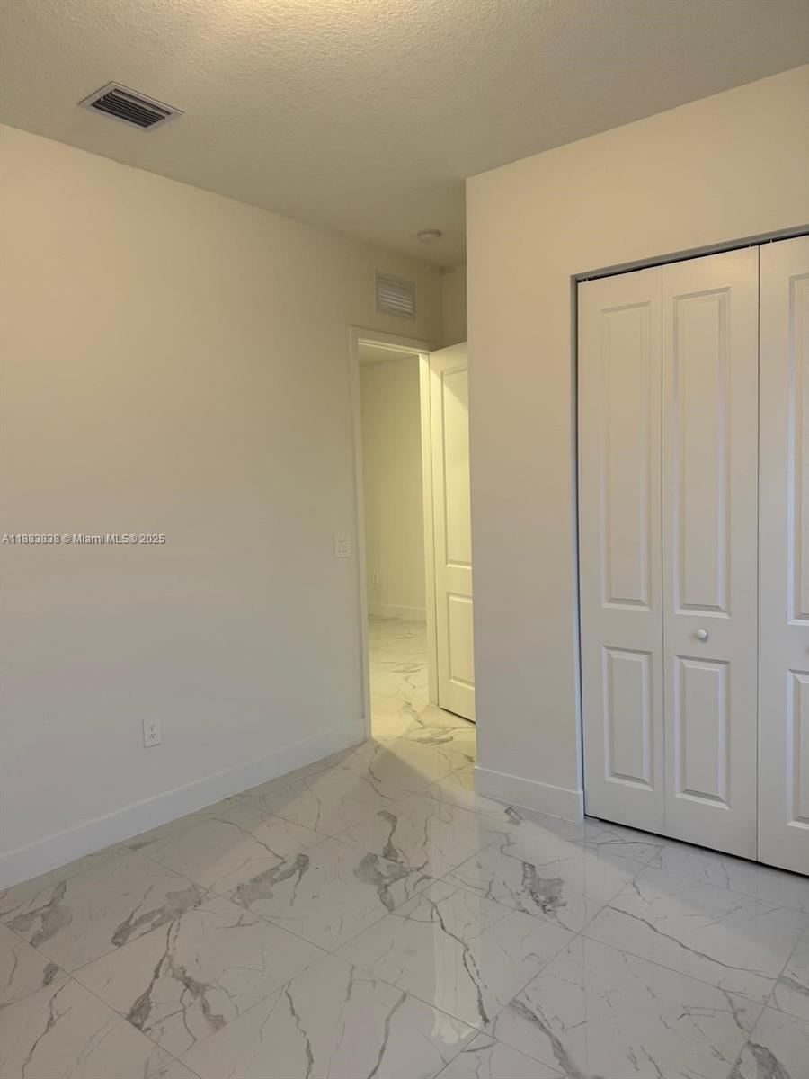 12303 Southwest 44th Street Davie, FL 33330 - Photo 7 of 42 a view of an empty room