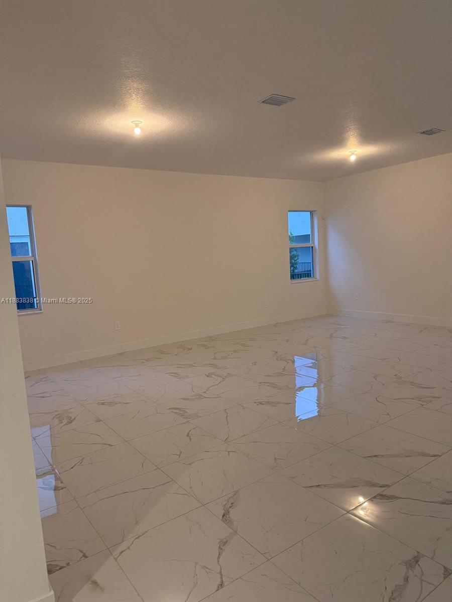 12303 Southwest 44th Street Davie, FL 33330 - Photo 10 of 42 a bathroom with a shower