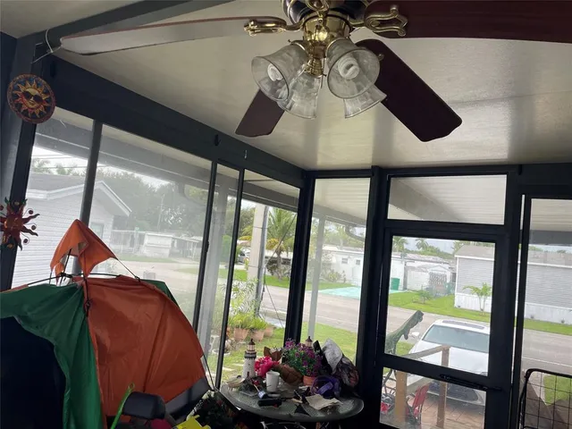 a room with furniture and a large window