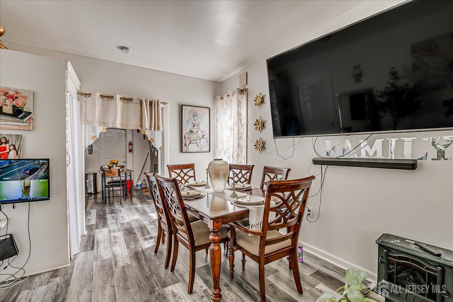 768 State Street Perth Amboy, NJ 08861 - Photo 18 of 35 a view of a dining room with furniture and wooden floor