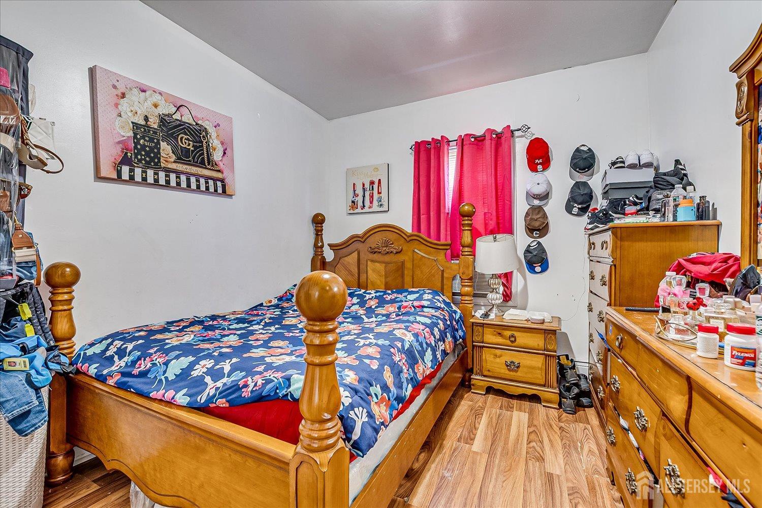 768 State Street Perth Amboy, NJ 08861 - Photo 20 of 35 a bedroom with a bed and a window