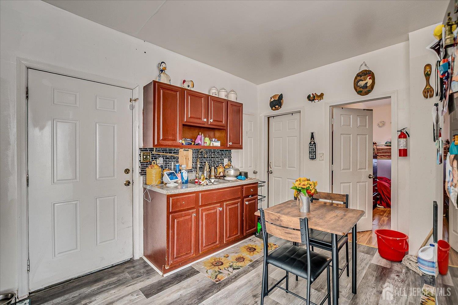 768 State Street Perth Amboy, NJ 08861 - Photo 23 of 35 a kitchen with stainless steel appliances granite countertop a sink and cabinets