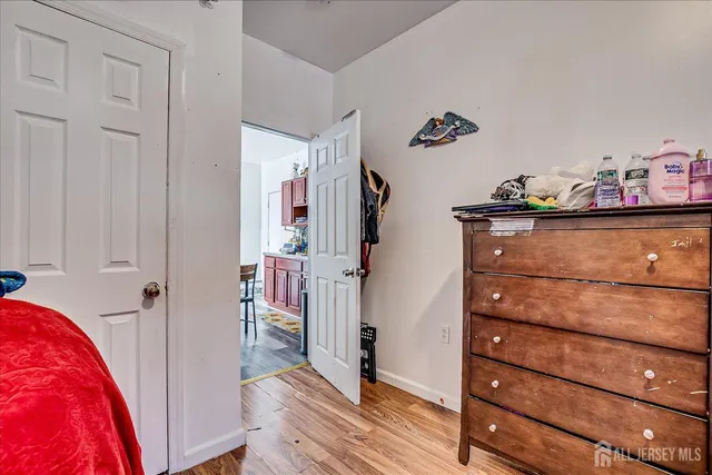 a bedroom with a bed and a walk in closet
