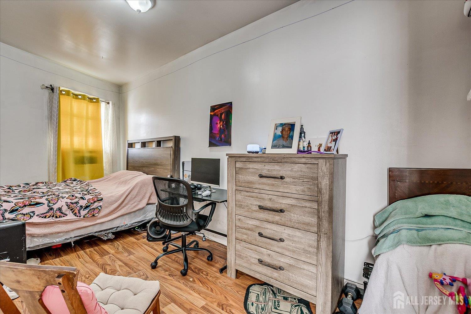 768 State Street Perth Amboy, NJ 08861 - Photo 27 of 35 a bedroom with a bed and furniture