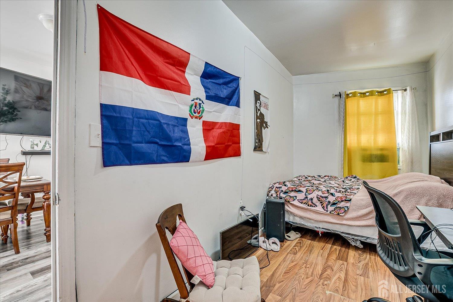 768 State Street Perth Amboy, NJ 08861 - Photo 28 of 35 a bedroom with a bed and wooden floor