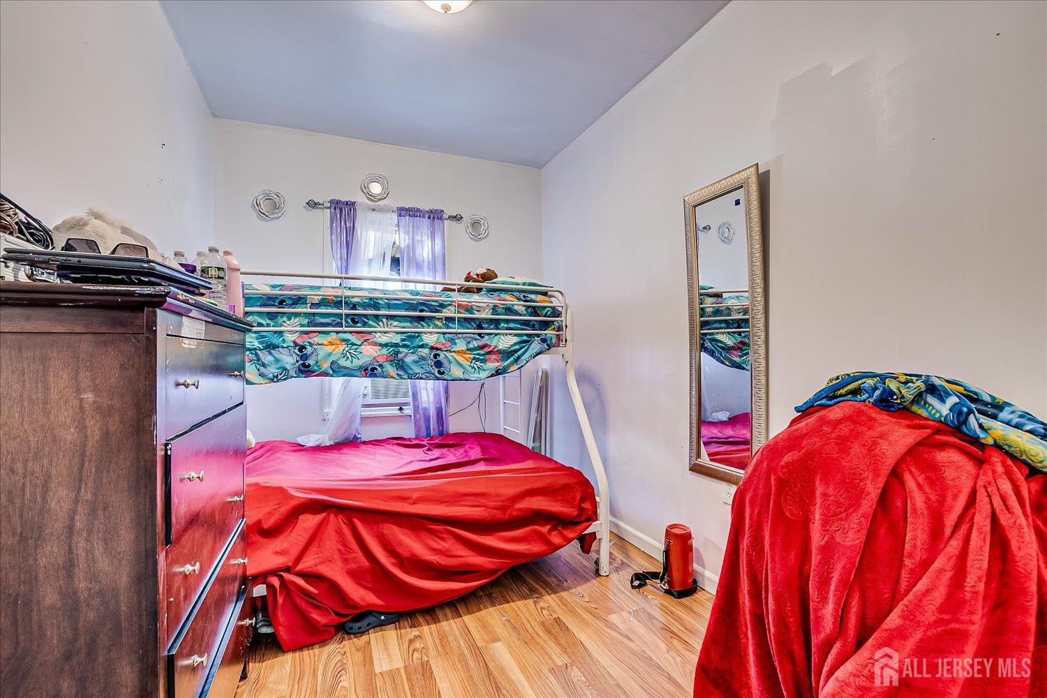 768 State Street Perth Amboy, NJ 08861 - Photo 29 of 35 a bedroom with two bed and a bathroom