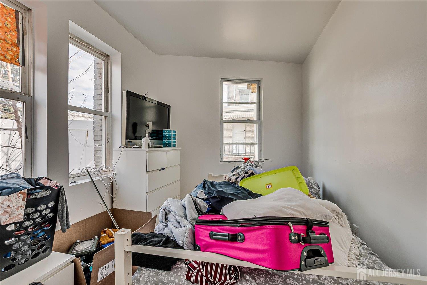 768 State Street Perth Amboy, NJ 08861 - Photo 33 of 35 a living room with furniture and a flat screen tv