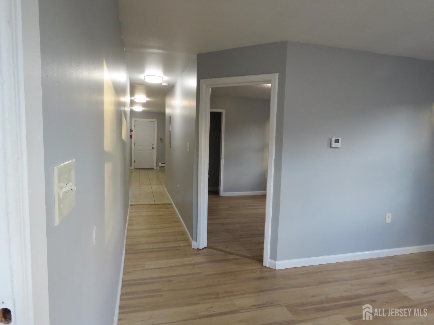 768 State Street Perth Amboy, NJ 08861 - Photo 7 of 35 a view of a hallway with wooden floor