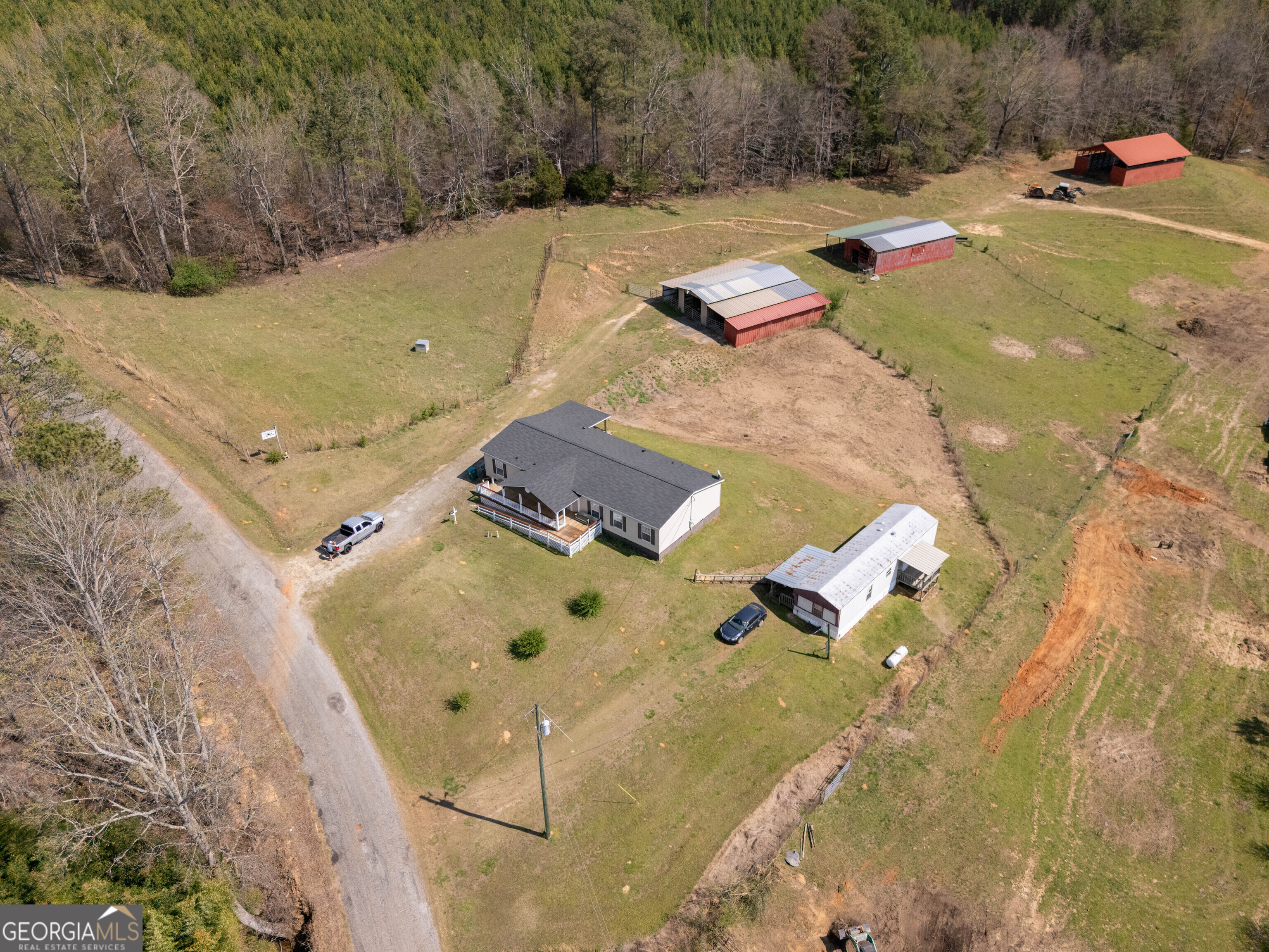793 County Road 114 Heflin, AL 36264 - Photo 1 of 1 an aerial view of residential houses with outdoor space