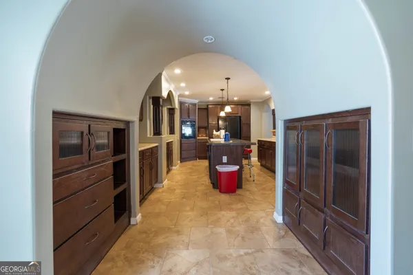 a kitchen with a sink dishwasher a stove and a refrigerator with wooden cabinets