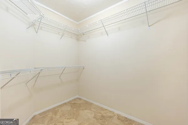 a bedroom with a bed and a table