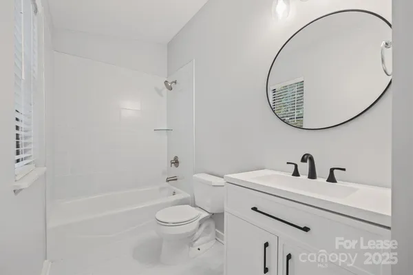 a bathroom with a toilet and a sink