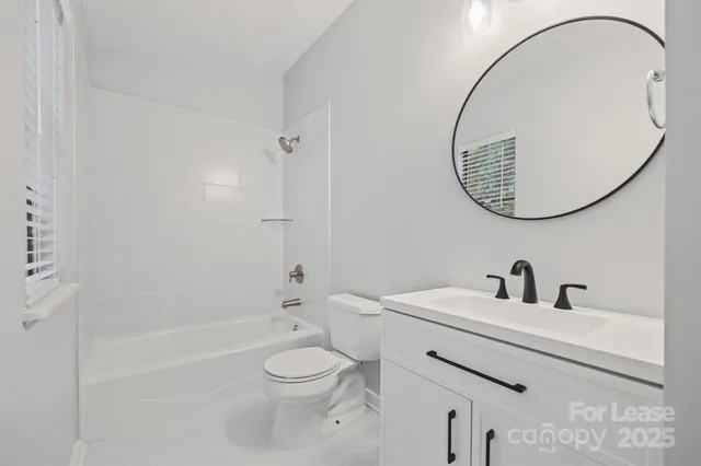 a bathroom with a toilet and a sink
