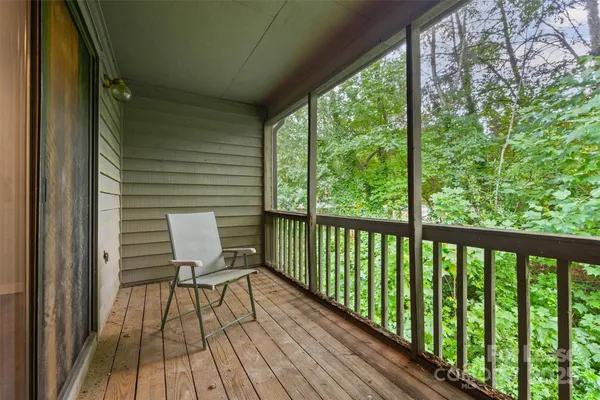 a view of a balcony with wooden floor
