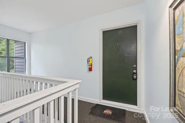 a view of a hallway with closet