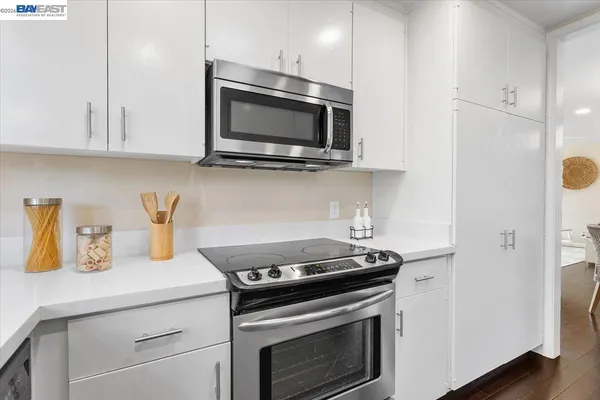 a kitchen with a stove and a microwave