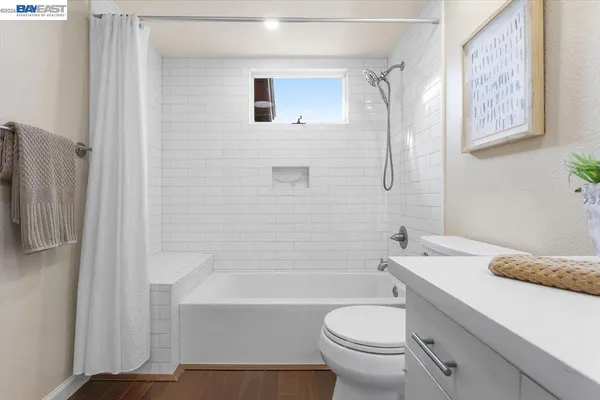 a bathroom with a sink a toilet and a bathtub
