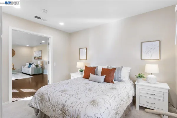 a bedroom with a bed and with furniture