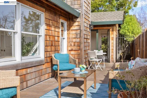 a outdoor space with patio the couches and a dining table with chairs