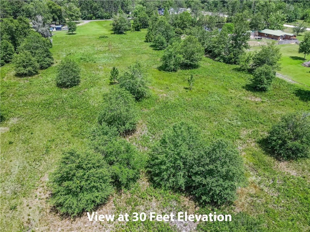 108 County Road Hilliard, FL 32046 - Photo 11 of 16 a view of a lush green space