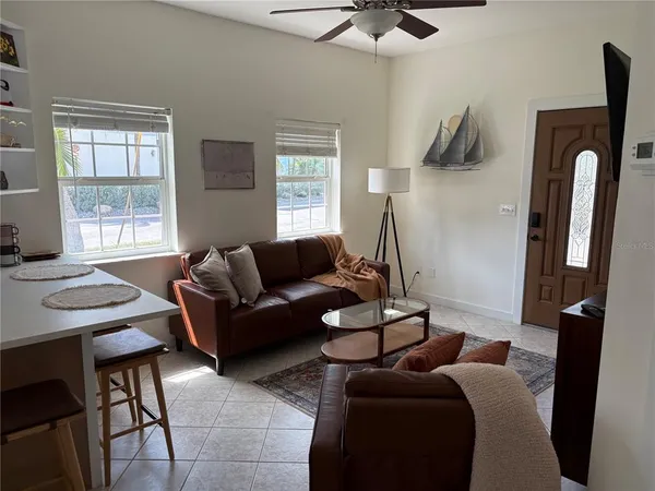 a living room with furniture and a window